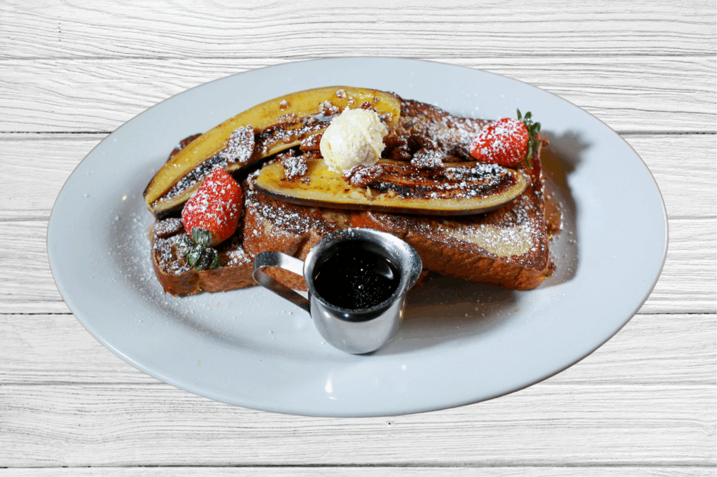 Calling all foodies, caramelized banana French toast with strawberries and syrup at Hash House A Go Go at The LINQ in Las Vegas.