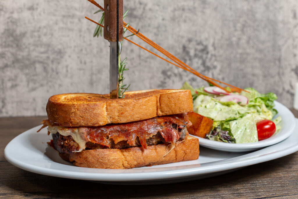 The Kokomo sandwich is a meal you cant live without from Hash House A Go Go The LINQ Las Vegas featuring griddled meatloaf, mozzarella, roasted tomato, and milk bread